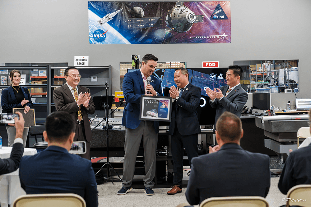 People applauding during a presentation ceremony